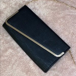 AKIRA Urban Expressions black asymmetrical clutch